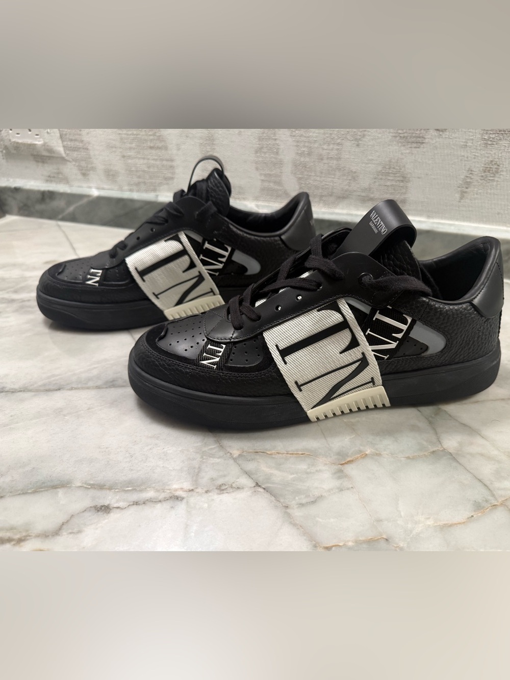 Valentino Garavani Black and White VLTN Strap Sneakers. Never worn
